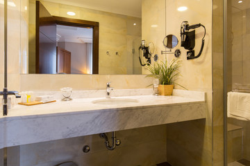 Hotel bathroom interior with shower cabin