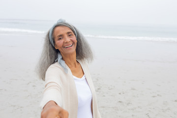 Woman smiling at the beach