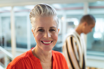 Female graphic designers smiling in office