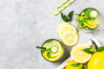 Refreshing lemon cucumber mint ginger infused water.Top view, space for text.