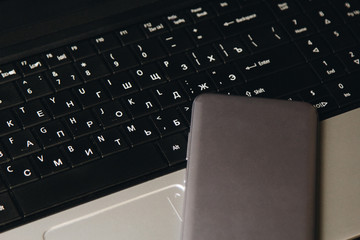 Fototapete - workplace blogger. kit for preparing for public speaking and writing text: laptop and smartphone top view. freelance job