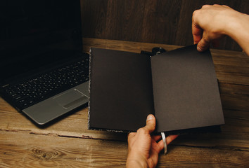 Fototapete - workplace blogger. set to prepare for public speaking and writing text: keyboard and phone on a wooden table, top view. freelancer writes the text in a notebook