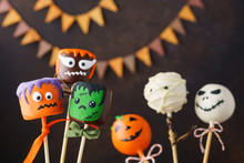 Halloween Cake Pops With Funny Monster Faces.
