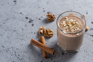Wall Mural - Chocolate milk smoothie with oatmeal and nuts. Place for text