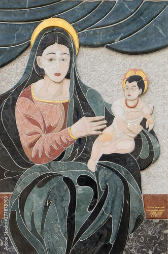 Virgin Mary With Baby Jesus House Facade In Lucca Tuscany Italy