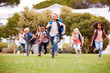 © Monkey Business - Excited Elementary School Pupils Running Across Field At Break Time