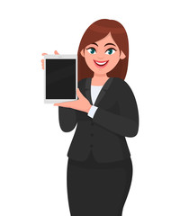 Happy young business woman showing or holding a brand new digital tablet computer in hand. Female character design illustration. Modern lifestyle, technology gadget concept in vector cartoon style.