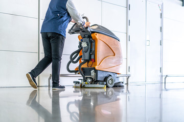 cleaning floor with machine