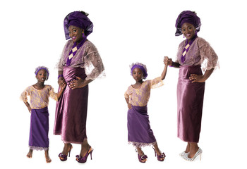 childhood and family concept - african woman and lovely little girl in traditional purple costume isolated