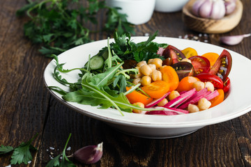 Wall Mural - Veggie chickpeas salad with fresh vegetables and herbs, plant based meal