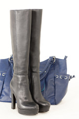 fashionable black boots with a handbag