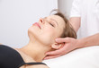 Woman receiving osteopathic treatment of her neck