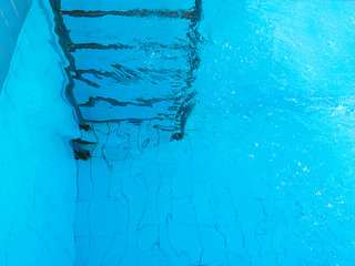 Wall Mural - stairs in swimming pool underwater. Abstract. Party. Summer. Vacation and sport concept.