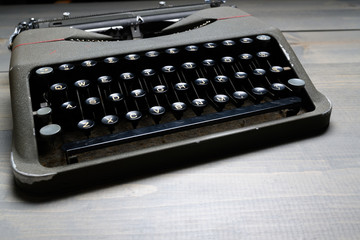 Retro old typewriter on wooden table background