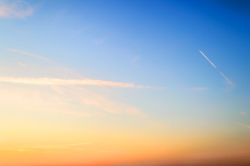 Wall Mural - blue and orange colored sky just before summer sunrise. beautiful dawn skyscape. clear paradise sky.