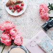 © Cavan Images - feminine flatlay on a paris map
