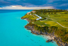 A Golf Course And A Hotel Near The Ocean In Bermuda