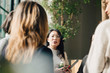 © Maskot - Female professional discussing with coworkers in meeting at conference event