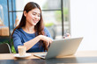 © chayathon2000 - Asian business girl working and drinking coffee in cafe