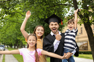 Wall Mural - Happy man with his family on graduation day