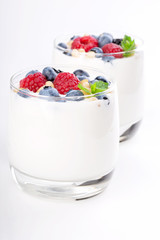 Poster - Two glasses of white yogurt with wild berries