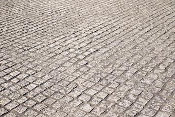 cobblestones road in perspective view