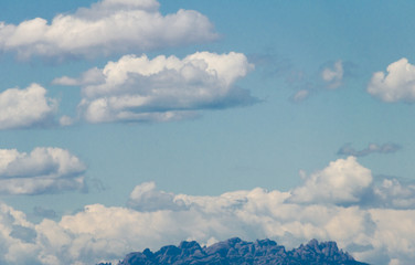 White clouds in the bright blue sky. The beauty of the nature