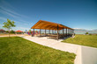 © Jason - Picnic pavilion and playground with view of lake snow peaked mountain and sky