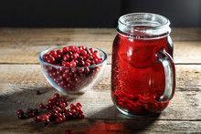 Cranberry Juice And Fresh Cranberries On The Table