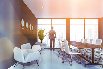 Canvas Print - Man in gray meeting room interior