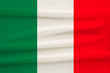 © kittyfly - The national flag of the country of Italy on gentle silk with wind folds, travel concept, immigration, politics, copy space, close-up