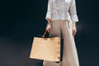 © LUMINA IMAGES - Unrecognisable stylish woman holding shopping bags.
