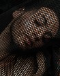 © Nelson Stein/Scopio - person under mesh black textile