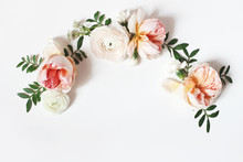 Decorative Wreath, Floral Garland, Composition With Pink English Roses, Ranunculus And Green Leaves On White Table Background. Flower Pattern. Flat Lay, Top View. Wedding, Birthday Styled Stock Photo.