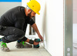 © Antonio Gravante - Worker builds a plasterboard wall.