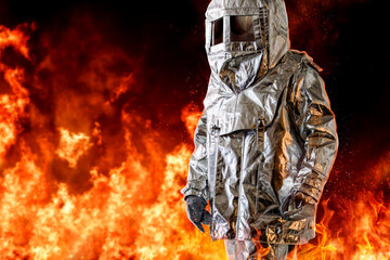 Fireman in a special protection suit. Professional protection against heat and open flame