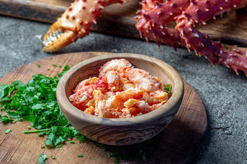 Wall Mural - Crab meat of king crab in wooden bowl on gray background