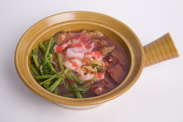 Top view yentafo rice noodles pink soup in bowl isolated on white background