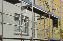 Metal Scaffold At Residential Building Under Renovation