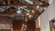 Lights Hanging From The Rafters Of Vintage Barn