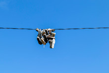 Shoes Hanging From A Electric Wire