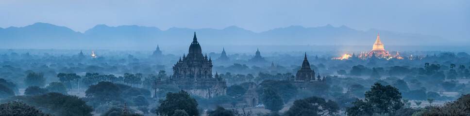 bagan panorama at night with golden shwezigon pagoda, myanmar