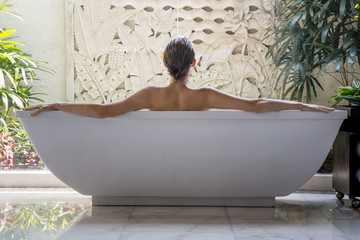 File name:Portrait of a young woman relaxing in the bathtub, organic skin-care at the luxury hotel spa, wellbeing and self-care concept