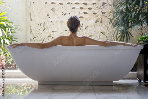 File name:Portrait of a young woman relaxing in the bathtub, organic skin-care at the luxury hotel spa, wellbeing and self-care concept