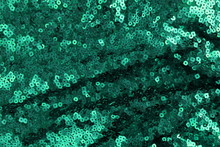 Green Sequins Background, Texture . Christmas, Festive Sparkling Background Closeup Full Frame