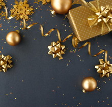 Christmas Or New Year Frame Decorations In Gold Colors On Dark Blue Background With Empty Copy Space For Text. Holiday And Celebration Concept For Postcard Or Invitation. Top View 