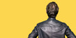 © Krakenimages.com - Middle age handsome man wearing black leather jacket standing backwards looking away with arms on body