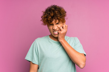 Wall Mural - Young african american man over isolated purple wall nervous and scared