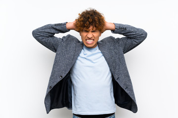 Wall Mural - Fashion african american man over isolated white wall frustrated and takes hands on head