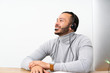 © luismolinero - Telemarketer Colombian man working in a office